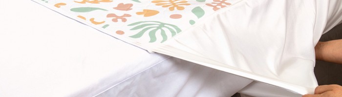 Organic Conni Bed Pad on bed