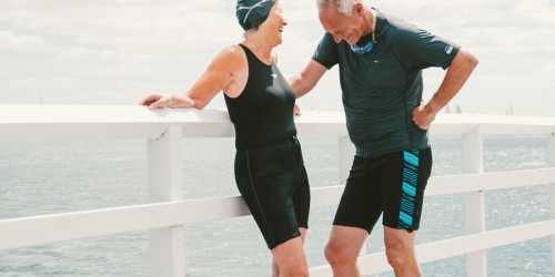Elderly couple wearing swim shorts