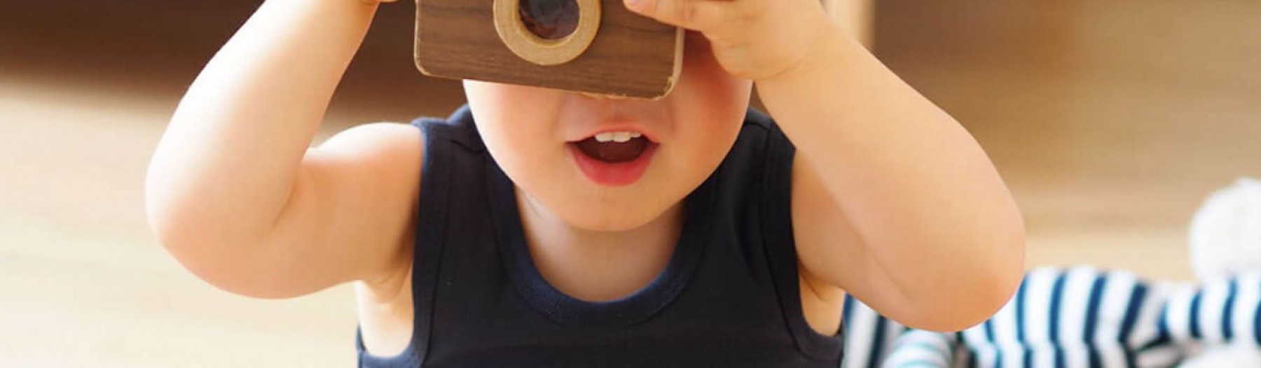 Kid aiming a camera at the screen