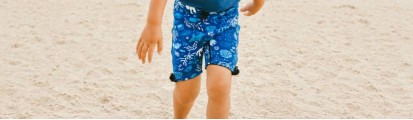 Child on Beach with swim shorts